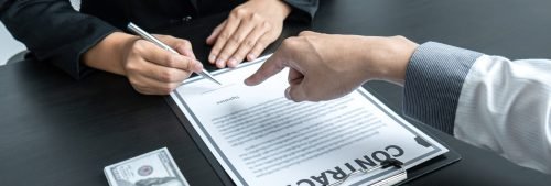 Dishonest cheating in illegal money, Businessman giving bribe money the form of dollar bills to while give success the deal to contract agreement, Bribery and corruption concept.